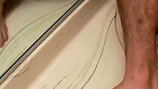 Bathroom cumshot all over this jock and his sexy feet too
