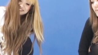 Two voluptuous Japanese girls peeing with their clothes on
