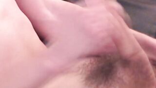 Young gay dude tugging and stroking on his long cock