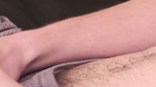 Young gay dude tugging and stroking on his long cock