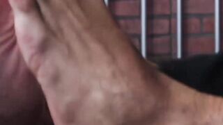 Bearded guard Rikk York receives foot licking from prisoner