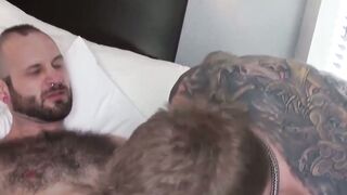 Tattooed bearded jock Reid Trasher rides big cock bareback