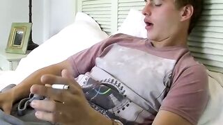 Stunning smoker blows smoke rings while he rubs his dick out