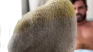 Bearded solo hunk admires his own feet while being recorded