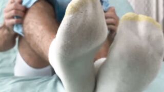 Bearded solo hunk admires his own feet while being recorded