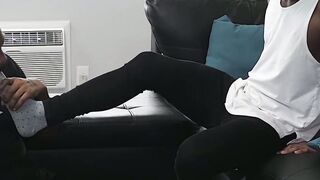 Black gay masturbates while his buddy is licking his feet