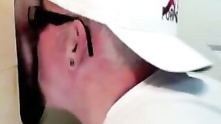 Horny dude with glasses enjoys in a glory hole scene
