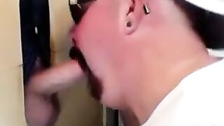 Horny dude with glasses enjoys in a glory hole scene