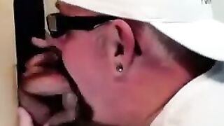Horny dude with glasses enjoys in a glory hole scene
