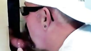 Horny dude with glasses enjoys in a glory hole scene