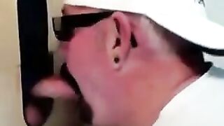 Horny dude with glasses enjoys in a glory hole scene