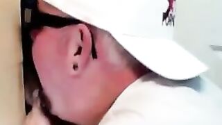 Horny dude with glasses enjoys in a glory hole scene