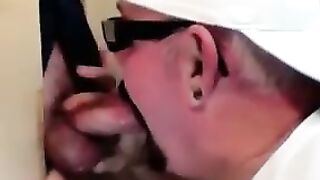 Horny dude with glasses enjoys in a glory hole scene