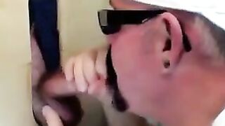 Horny dude with glasses enjoys in a glory hole scene