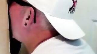 Horny dude with glasses enjoys in a glory hole scene