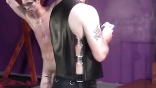 Slim gay with glasses restrained for dominant erotic torment