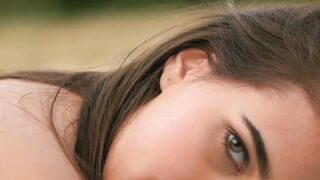 Sensual teen Katrine Pirs shows off shaved pussy outdoors