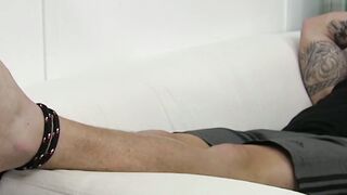 Bound inked hunk with mouth fold receives feet licking
