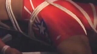 Hunk in uniform is tied up as he tries to release himself