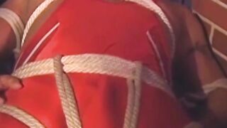 Hunk in uniform is tied up as he tries to release himself