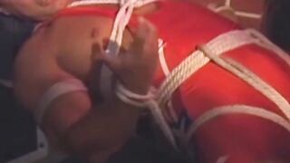 Hunk in uniform is tied up as he tries to release himself