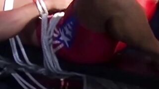 Hunk in uniform is tied up as he tries to release himself