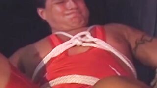 Hunk in uniform is tied up as he tries to release himself