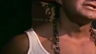 Tattooed man in uniform cant release himself from chains