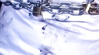Tattooed man in uniform cant release himself from chains