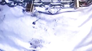 Tattooed man in uniform cant release himself from chains
