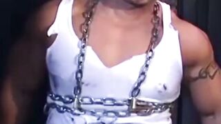 Tattooed man in uniform cant release himself from chains