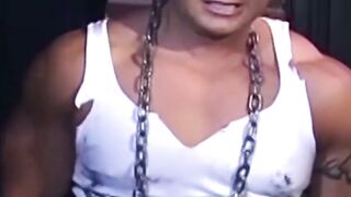 Tattooed man in uniform cant release himself from chains