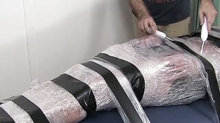 Restrained hunk endures tickling torment from his dom