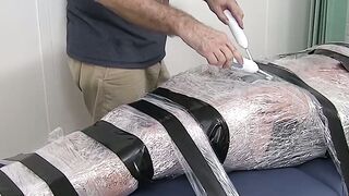 Restrained hunk endures tickling torment from his dom