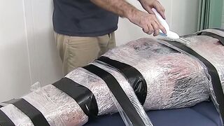 Restrained hunk endures tickling torment from his dom