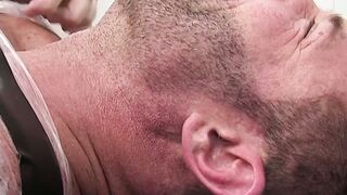 Restrained hunk endures tickling torment from his dom
