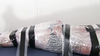 Restrained hunk endures tickling torment from his dom