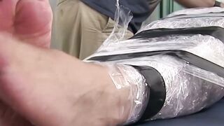 Restrained hunk endures tickling torment from his dom