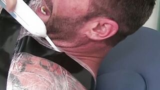 Restrained hunk endures tickling torment from his dom