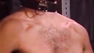 Man with muscles is restrained while only in his underwear