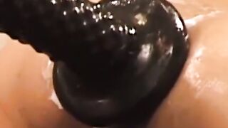 This deviant black stud fills his ass with the biggest dildo ever, stretching it like
