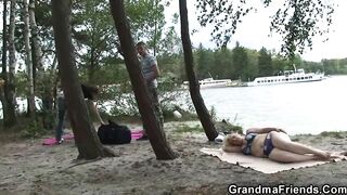 Blonde granma double penetration on the beach