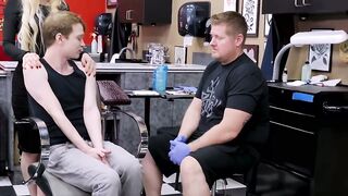 Horny blonde Natasha James rides a big cock during a tattoo session with young Matthe