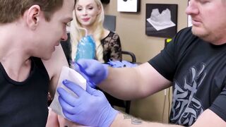 Horny blonde Natasha James rides a big cock during a tattoo session with young Matthe