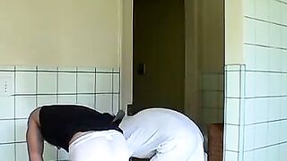 Kelly Cooper and Grant Hiller in a full strip wrestle match
