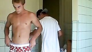 Kelly Cooper and Grant Hiller in a full strip wrestle match