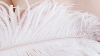 Stunning redhead Madelane caresses her lovely body through her silk lingerie