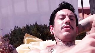 Slim Alexis Clark jacked his gigantic cock while working on his tan on the rooftops