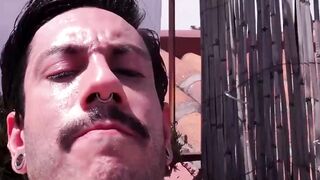Slim Alexis Clark jacked his gigantic cock while working on his tan on the rooftops