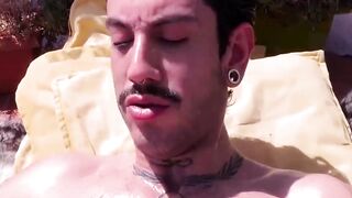 Slim Alexis Clark jacked his gigantic cock while working on his tan on the rooftops